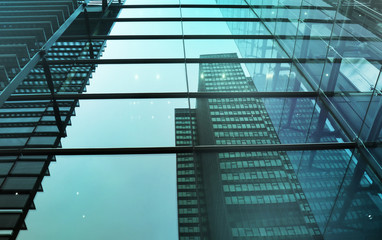 Part of a building and reflections in the facade.