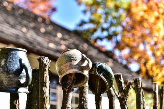 Clay pots hanging on the fence