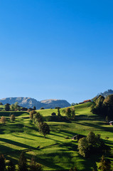 Farmland and rural cottages on hills in suburb area of Montreux
