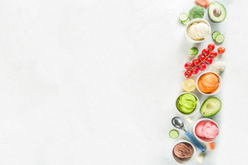 Trendy vegan food, summer healthy dessert concept, colorful diet vegetable ice cream with avocado, cucumber, tomato, beet, carrot, broccoli, cauliflower. Frozen veggie smoothie,  banner