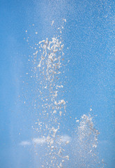 Splashes of water against the blue sky