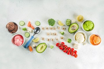 Trendy vegan food, summer healthy dessert concept, colorful diet vegetable ice cream with avocado, cucumber, tomato, beet, carrot, broccoli, cauliflower. Frozen veggie smoothie,  banner