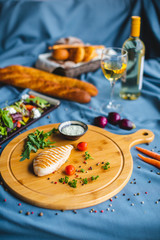 chicken fillet with sauce and salad