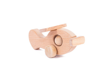 Photo of a wooden plane  of beech. Toy made of wood retro aircraft on a white isolated background