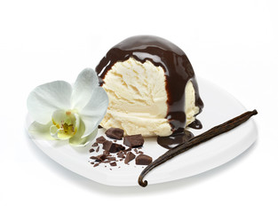 Vanilla ice cream scoop with bean or pod, chocolate syrup, sauce or sherbet in bowl isolated on...