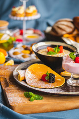 Fototapeta na wymiar breakfast with pancakes, cereal, yogurt, light breakfast