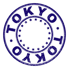 TOKYO stamp seal imprint with grunge texture. Designed with circles and stars. Blue vector rubber print of TOKYO title with dust texture.