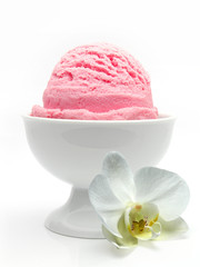 Strawberry ice cream scoop in bowl isolated on white background