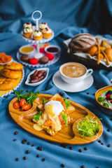 poached egg, breakfast with coffee and scrambled eggs and toast in a pan