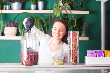 Woman seller show the pastila in the raw shop
