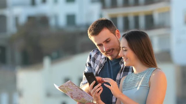 Confused tourists booking hotel finding amazing online offer on vacation at sunset
