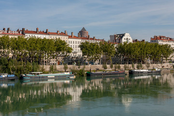Fototapeta na wymiar Lyon France 12-15-2018. Barge moored on the Rhone river in Lyon 