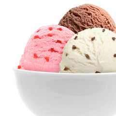 Strawberry, vanilla and chocolate ice cream scoops with chocolate parts in bowl isolated on white background