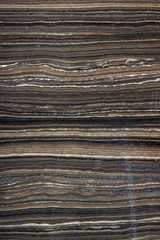 Natural marble with horizontal stripes brown color, called Tobacco Brown or Eramosa