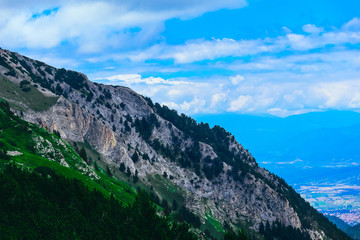 Beautiful alpine high mountains peak, blue sky background. Amazing Mountain hiking paradise...