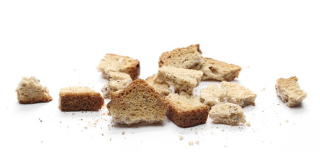 Integral toast slice with linseed and sunflower seeds crumbs isolated on white background