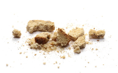 Integral toast slice with linseed and sunflower seeds crumbs isolated on white background
