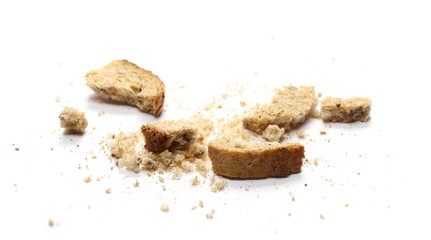 Integral toast slice with linseed and sunflower seeds crumbs isolated on white background