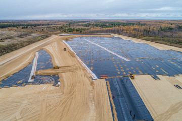 the construction of the landfill and installation of geomembrane