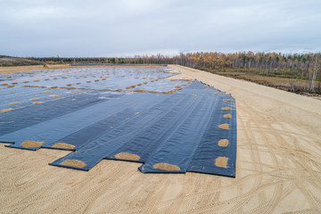 the construction of the landfill and installation of geomembrane