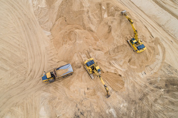 loading sand excavator in a dump truck on the construction site