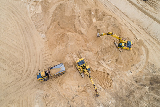 Loading Sand Excavator In A Dump Truck On The Construction Site