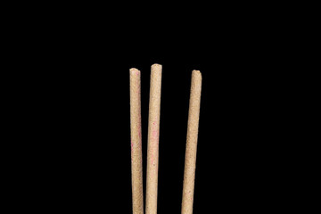 The incense on the black background