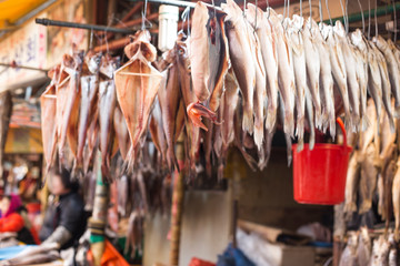 Fototapeta na wymiar Dried fish hanging on a rope