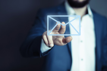 businessman hand pushing mail sign