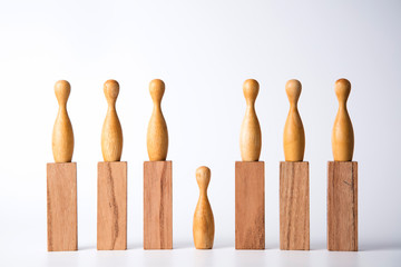Business leadership concept. Wooden figures on blocks