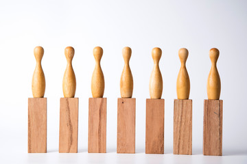 Business leadership concept. Wooden figures on blocks