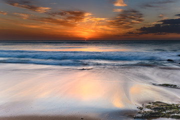 Fototapeta na wymiar Orange Glow Sunrise Seascape