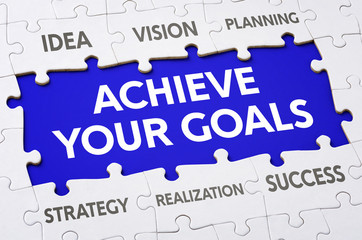 Text on puzzle pieces - Achieve your goals