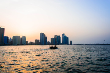 Small boat sailing in sea at Golden Hour