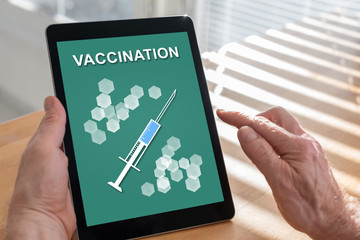 Vaccination concept on a tablet