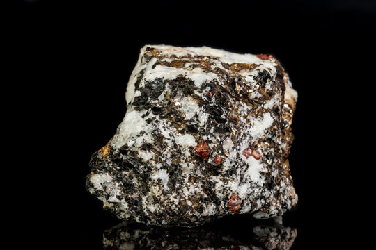 Macro Zircon mineral stone on a black background