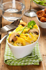 Grilled mushrooms on a pasta dish with sauce
