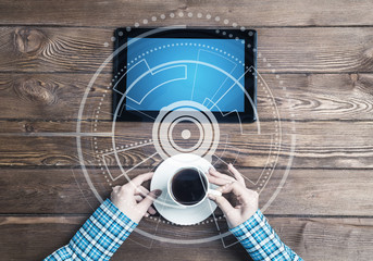 Business workplace with tablet device coffee cup and media interface