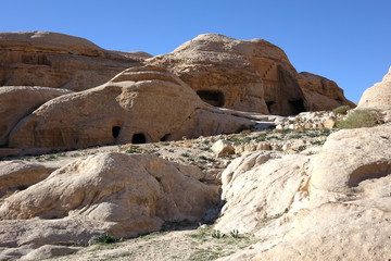 Fototapeta na wymiar Jordan. The mojntains with holes of Petra
