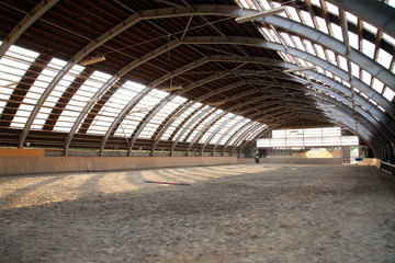 Empty riding hall  building interior without people ready for equestrian training wintertime