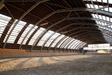 Empty riding hall  building interior without people ready for equestrian training wintertime