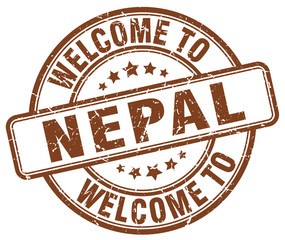 welcome to Nepal brown round vintage stamp