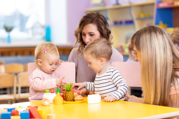 Preschool children in the classroom with kindergarten teacher