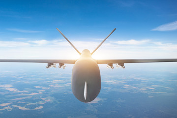 Military drone close up view, flying high in the sky.