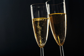 Champagne glasses for festive occasion against a dark background