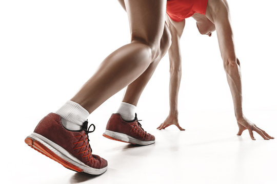 Portrait Of Young Sporty Woman At Starting Block Of Race Isolated Over White Studio Background. The Sprinter, Jogger, Exercise, Workout, Fitness, Training, Jogging Concept. Profile