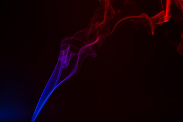Colorful smoke close-up on a black background
