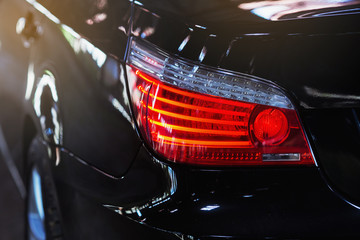 Black car. Luxury taillights. Car lights. 