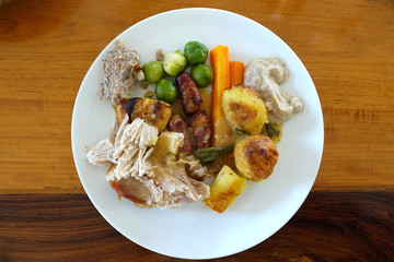 Typical Christmas Dinner with turkey, roast veg and brussel sprouts