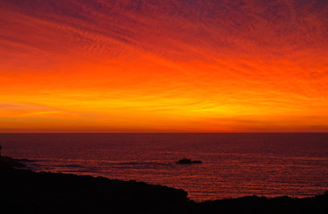 Fototapeta premium Bright orange sunrise in the algarve